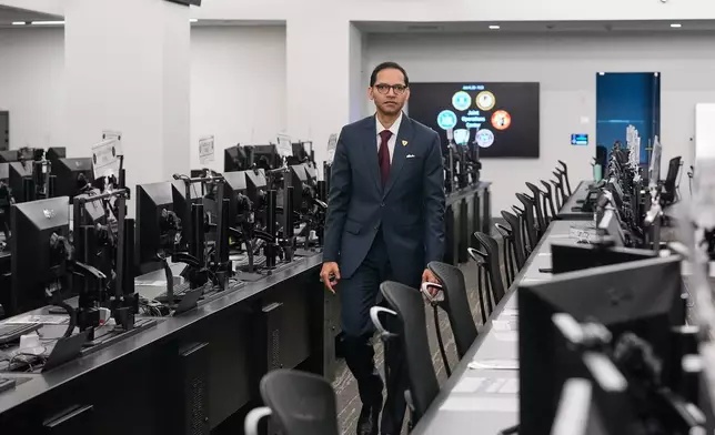 FBI Special Agent in Charge Amit Kachhia-Patel, Mission Services Division, walks through a portion of the agency's Joint Operations Center in New York, Thursday, June 4, 2026, ahead of the World Cup soccer tournament. (AP Photo/Richard Drew)