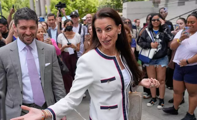 Karen Friedman Agnifilo, center, and Jacob Kaplan, left, lawyers for Luigi Mangione, are surrounded by media as they leave a federal courthouse in New York, Monday, June 29, 2026. (AP Photo/Seth Wenig)
