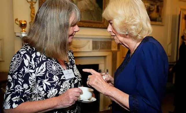 FILE - Queen Camilla, right, speaks with author Julia Donaldson during a reception to celebrate the centenary of BookTrust, at Clarence House, London, Tuesday, Oct. 14, 2025. (Aaron Chown/PA via AP, Pool)