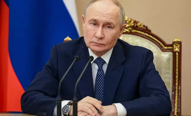 Russian President Vladimir Putin chairs a meeting on measures to support relatives of those killed and injured in the attack on a college in Starobilsk, of the Russia-controlled Luhansk region of Ukraine, at the Kremlin in Moscow, Monday, June 1, 2026. (Vyacheslav Prokofyev/Sputnik, Kremlin Pool Photo via AP)