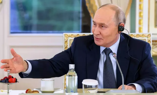 Russian President Vladimir Putin gestures during a meeting with representatives of international news agencies on the sidelines of the St. Petersburg International Economic Forum at the Constantine Palace in St. Petersburg, Russia, on Thursday, June 4, 2026. (Alexander Kazakov, Sputnik, Kremlin Pool Photo via AP)