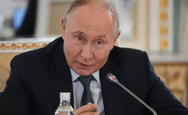 Russian President Vladimir Putin speaks to representatives of international news agencies on the sidelines of the St. Petersburg International Economic Forum at the Constantine Palace in St. Petersburg, Russia, on Thursday, June 4, 2026. (AP Photo/Dmitri Lovetsky, Pool)