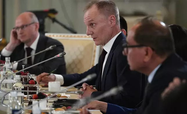 The Associated Press News Director of Europe/Africa James Jordan, center, attends Russian President Vladimir Putin's meeting with representatives of international news agencies on the sidelines of the St. Petersburg International Economic Forum at the Constantine Palace in St. Petersburg, Russia, on Thursday, June 4, 2026. (AP Photo/Dmitri Lovetsky, Pool)