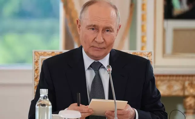 Russian President Vladimir Putin meets with representatives of international news agencies on the sidelines of the St. Petersburg International Economic Forum at the Constantine Palace in St. Petersburg, Russia, on Thursday, June 4, 2026. (AP Photo/Dmitri Lovetsky, Pool)