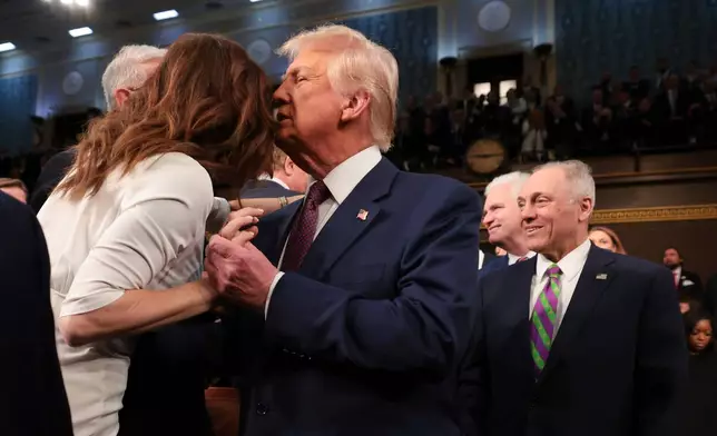 FILE - President Donald Trump embraces Rep. Nancy Mace, R-S.C., as he arrives to address a joint session of Congress at the Capitol in Washington, March 4, 2025. (Win McNamee/Pool Photo via AP, File)