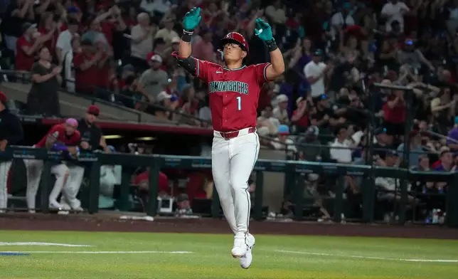 Arizona Diamondbacks' Jorge Barrosa (1) celebrates his two-run home run against the Minnesota Twins in the fifth inning of a baseball game Saturday, June 20, 2026, in Phoenix. (AP Photo/Darryl Webb)