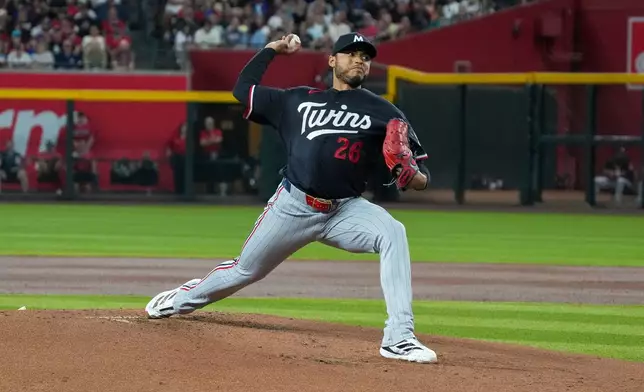Minnesota Twins pitcher Taj Bradley works against the Arizona Diamondbacks during the first inning of a baseball game Saturday, June 20, 2026, in Phoenix. (AP Photo/Darryl Webb)