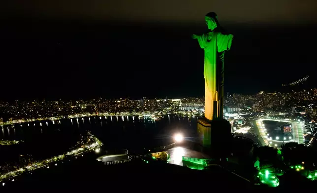 Christ the Redeemer monument is illuminated in Brazil's national colors as part of the countdown to the 2027 FIFA Women's World Cup, in Rio de Janeiro, Brazil, Tuesday, June 23, 2026. (AP Photo/Dhavid Normando)