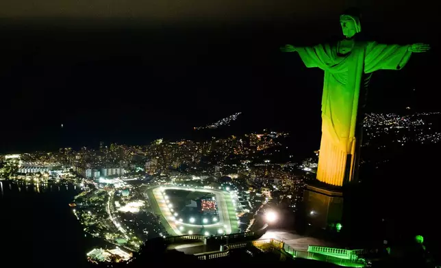 Christ the Redeemer monument is illuminated in Brazil's national colors as part of the countdown to the 2027 FIFA Women's World Cup, in Rio de Janeiro, Brazil, Tuesday, June 23, 2026. (AP Photo/Dhavid Normando)