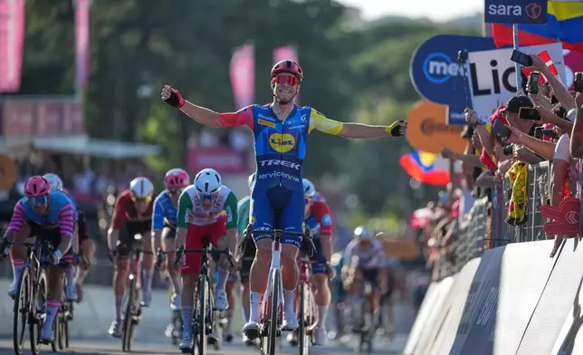 Italy's Jonathan Milan celebrates at the finish line after winning the last stage of the Giro d'Italia in Rome Sunday May 31, 2026. (AP Photo/Andrew Medichini)