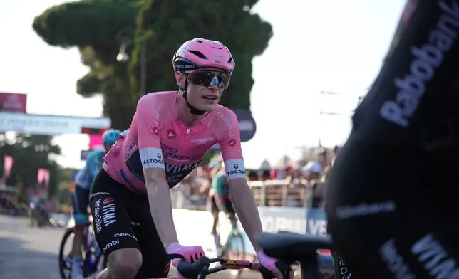 Overall leader Denmark's Jonas Vingegaard arrives at the finish line of the last stage of the Giro d'Italia in Rome Sunday May 31, 2026. (AP Photo/Andrew Medichini)