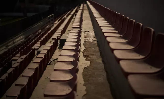 Empty seats line the grandstands at Faisal al-Husseini Stadium in the West Bank town of Al-Ram, Monday, May 11, 2026. (AP Photo/Leo Correa)
