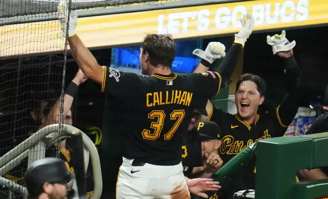 Pittsburgh Pirates' Tyler Callihan (37) takes a curtain call on the dugout steps after hitting a three-run home run off Los Angeles Dodgers pitcher Kyle Hurt during the eighth inning of a baseball game in Pittsburgh, Wednesday, June 10, 2026. (AP Photo/Gene J. Puskar)