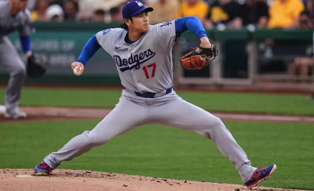 Los Angeles Dodgers two-way player Shohei Ohtani delivers during the first inning of a baseball game against the Pittsburgh Pirates in Pittsburgh, Wednesday, June 10, 2026. (AP Photo/Gene J. Puskar)