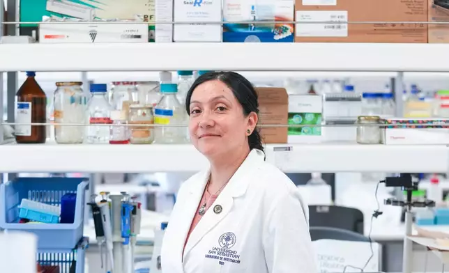 María Inés Barría, a virologist at the Universidad San Sebastián, poses for a picture at the university in Santiago, Chile, Wednesday, May 20, 2026. (AP Photo/Esteban Felix)