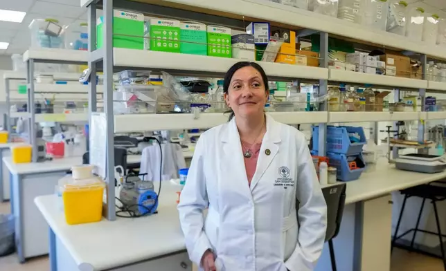 María Inés Barría, a virologist at the Universidad San Sebastián, poses for picture at the university, in Santiago, Chile, Wednesday, May 20, 2026. (AP Photo/Esteban Felix)