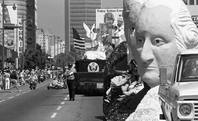 FILE - Floats and participants in the 10.8-mile All Nation, All People Official Los Angeles County Bicentennial Parade along Wilshire Boulevard in Los Angeles, Sunday, July 4, 1976. (AP Photo/File)