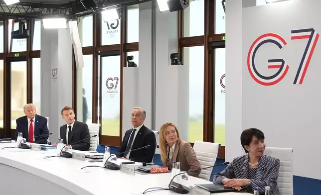 From right, U.S. President Donald Trump, French President Emmanuel Macron, Canadian Prime Minister Mark Carney, Italian Prime Minister Giorgia Meloni and Japan's Prime Minister Sanae Takaichi during a working session at the G7 summit in Evian-les-Bains, France, Wednesday, June 17, 2026. (AP Photo/Thibault Camus)