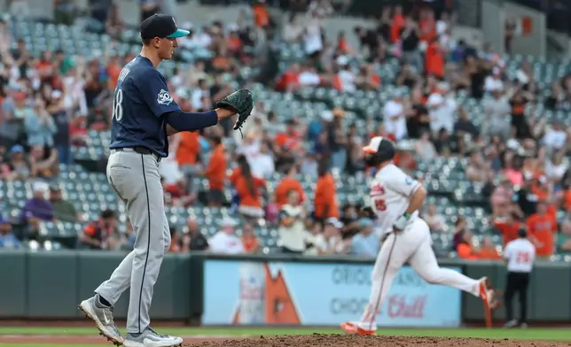 Seattle Mariners pitcher George Kirby walks back onto the mound after surrendering a home run to Baltimore Orioles' Pete Alonso during the fifth inning of a baseball game, Wednesday, June 10, 2026, in Baltimore. (AP Photo/Terrance Williams)