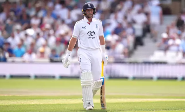 England's Joe Root walks off the field after being bowled out by New Zealand's Nathan Smith via lbw during day three of the Third Test cricket match between England and New Zealand, in Nottingham, England, Saturday June 27, 2026. (Mike Egerton/PA via AP)