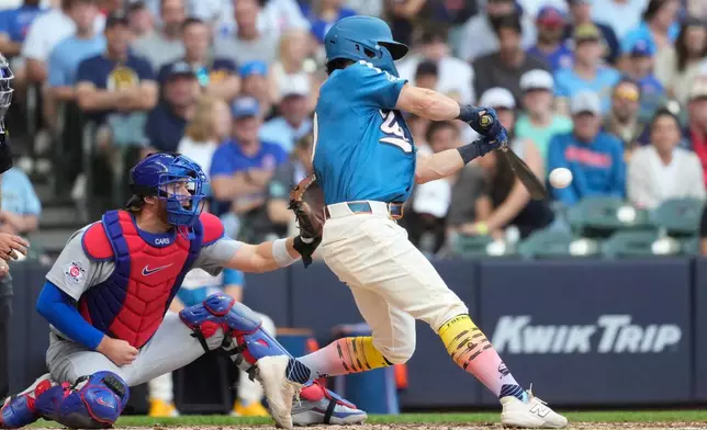 Milwaukee Brewers' Sal Frelick hits an RBI single during the fifth inning of a baseball game against the Chicago Cubs, Saturday, June 27, 2026, in Milwaukee. (AP Photo/Aaron Gash)