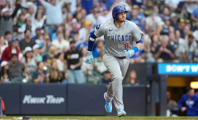 Chicago Cubs' Ian Happ rounds the bases after hitting a three-run home run during the sixth inning of a baseball game against the Milwaukee Brewers, Saturday, June 27, 2026, in Milwaukee. (AP Photo/Aaron Gash)