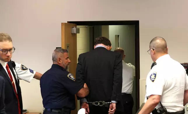 Gilgo Serial Killer Rex Heuermann is escorted away after being sentenced by Judge Timothy Mazzei at Suffolk County Court in Riverhead, N.Y., on Wednesday, June 17, 2026. (James Carbone/Newsday via AP, Pool)
