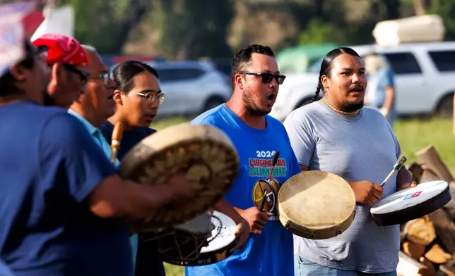 Drummers honor runners during festivities to commemorate the 150th anniversary of the Battle of the Little Bighorn, Thursday, June 25, 2026, in Crow Agency, Mont. (AP Photo/Tailyr Irvine)