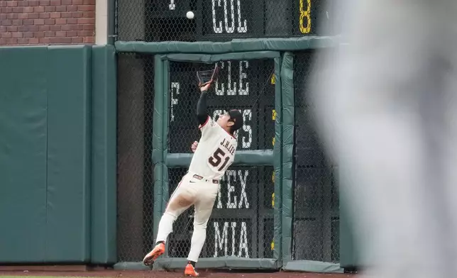 San Francisco Giants right fielder Jung Hoo Lee catches a fly out hit by Athletics' Shea Langeliers during the fourth inning of a baseball game Wednesday, June 24, 2026, in San Francisco. (AP Photo/Jeff Chiu)