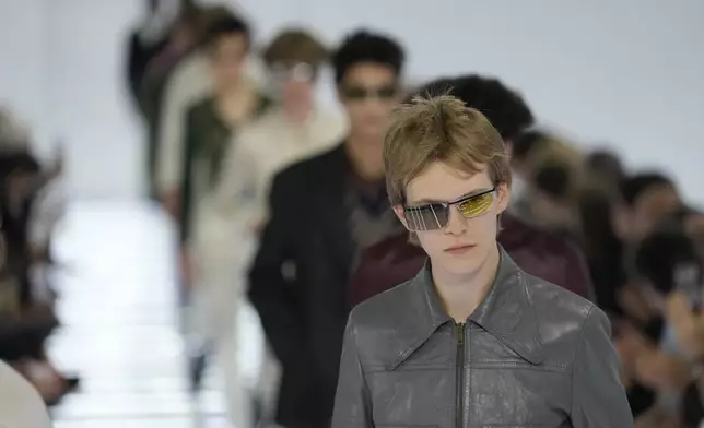 A model wears a creation from Prada's Spring/Summer 2027 men's collection presented in Milan, Italy, Sunday, June 21, 2026. (AP Photo/Luca Bruno)