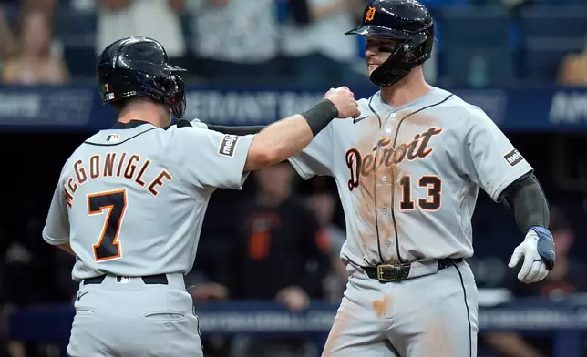 Detroit Tigers' Dillon Dingler (13) celebrates with Kevin McGonigle (7) after Dingler hit a two-run home run off Tampa Bay Rays pitcher Griffin Jax during the third inning of a baseball game Monday, June 1, 2026, in St. Petersburg, Fla. (AP Photo/Chris O'Meara)