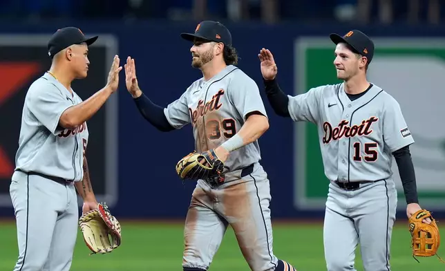 Detroit Tigers, from left, Hao-Yu Lee, Zach McKinstry, and Zack Short, celebrate after the team defeated the Tampa Bay Rays during a baseball game Monday, June 1, 2026, in St. Petersburg, Fla. (AP Photo/Chris O'Meara)