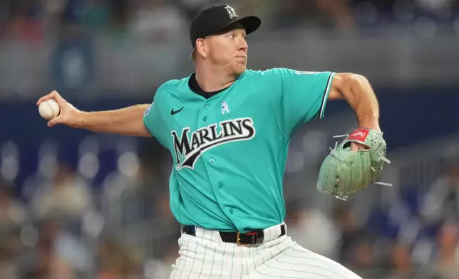 Miami Marlins starting pitcher Ryan Gusto throws during the first inning of a baseball game against the San Francisco Giants, Sunday, June 21, 2026, in Miami. (AP Photo/Jim Rassol)