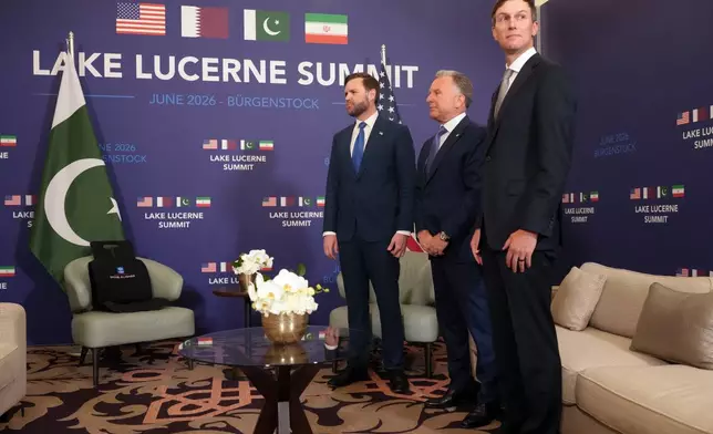 U.S. Vice President JD Vance waits, alongside U.S. President Donald Trump's envoys Steve Witkoff, second right, and Jared Kushner, right, to meet with Pakistan's Prime Minister Shehbaz Sharif for high-level talks aimed at advancing a deal to end the Middle East conflict, at the Bürgenstock Resort in Obbuergen, near Lucerne, in Switzerland, Sunday, June 21, 2026. (Nathan Howard/Pool Photo via AP)