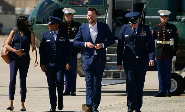 Vice President JD Vance, center, and second lady Usha Vance, left, walk from Marine Two as they arrive at Joint Base Andrews, Md., Saturday, June 20, 2026, en route to Switzerland. (Elizabeth Frantz/Pool Photo via AP)