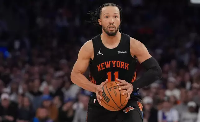 New York Knicks' Jalen Brunson (11) looks to pass during the second half of Game 2 in the Eastern Conference finals NBA basketball playoffs series against the Cleveland Cavaliers, Thursday, May 21, 2026, in New York. (AP Photo/Frank Franklin II)
