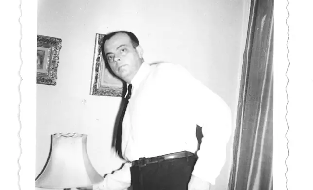 Antoine de Saint-Exupéry lighting a lamp in Silvia Hamilton's apartment