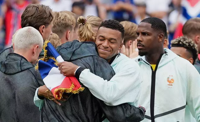 France's Kylian Mbappe and Norway's Erling Haaland, left, greet each other before the World Cup Group I soccer match between Norway and France in Foxborough, Mass., near Boston, Friday, June 26, 2026. (AP Photo/Martin Meissner)