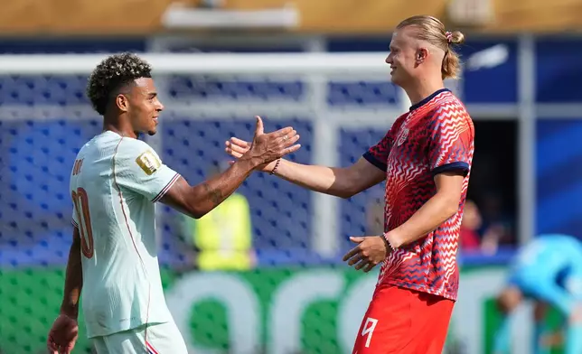 Norway's Erling Haaland and France's Desire Doue, left, shake hands at the end of the World Cup Group I soccer match between Norway and France in Foxborough, Mass., near Boston, Friday, June 26, 2026. (AP Photo/Martin Meissner)