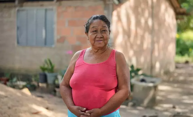 Lucirene Javae, the eldest Indigenous woman in Boa Esperanca community, stands outside her house on Bananal Island in Formoso do Araguaia, Tocantins state, Brazil, Friday, May 22, 2026. (AP Photo/Andre Penner)