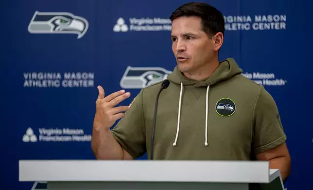 Seattle Seahawks head coach Mike Macdonald talks to the media after NFL football practice at the team's training facility, Wednesday, June 10, 2026, in Renton, Wash. (AP Photo/Stephen Brashear)