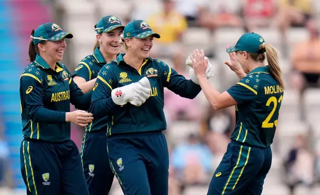 Georgia Voll of Australia, second left, celebrates the wicket of Phebe Molkenboer of the Netherlands during the Women's T20 World Cup match between Australia and Netherlands in Southampton, England, Saturday June 20, 2026. (Andrew Matthews/PA via AP)