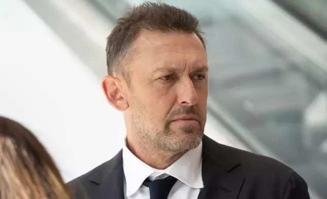 Australia head coach Tony Popovic arrives with the players ahead of the World Cup soccer tournament in San Francisco, Sunday, May 31, 2026. (AP Photo/Minh Connors)