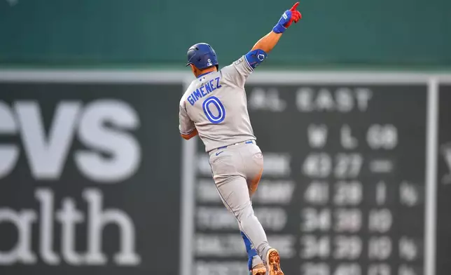 Toronto Blue Jays' Andrés Giménez celebrates as he runs the bases on his home run in the fifth inning of a baseball game against the Boston Red Sox, Tuesday, June 16, 2026, in Boston. (AP Photo/Steven Senne)