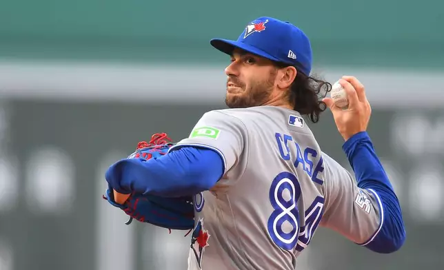 Toronto Blue Jays' Dylan Cease winds up for a pitch to a Boston Red Sox batter in the first inning of a baseball game, Tuesday, June 16, 2026, in Boston. (AP Photo/Steven Senne)