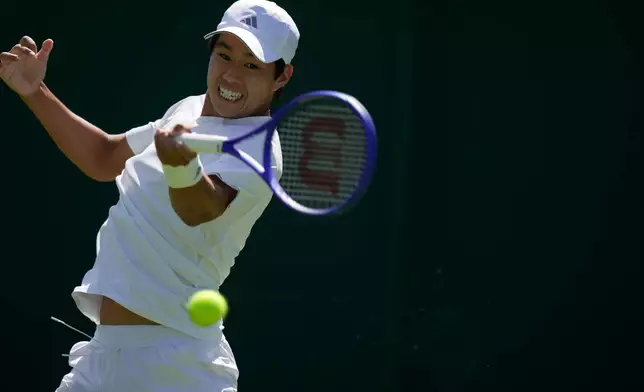 Learner Tien of the United States returns the ball to Dalibor Svrcina of Czech Republic in their first round men's singles match at the Wimbledon Tennis Championships in London, Monday, June 29, 2026. (AP Photo/Brian Inganga)
