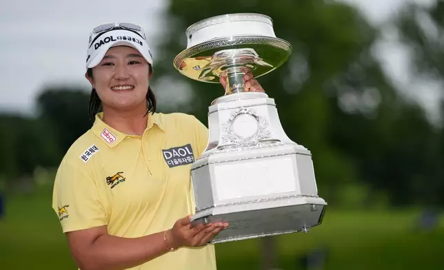 Haeran Ryu, of South Korea, poses with the trophy after winning the Women's PGA Championship golf tournament at Hazeltine National Golf Club, Sunday, June 28, 2026, in Chaska, Minn. (AP Photo/Chris Carlson)