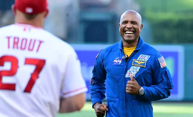 Artemis II Astronaut Victor Glover throws out the first pitch before a a Tampa Bay Rays and Los Angeles Angels baseball game Friday, June 12, 2026, in Anaheim, Calif. (AP Photo/Wally Skalij)