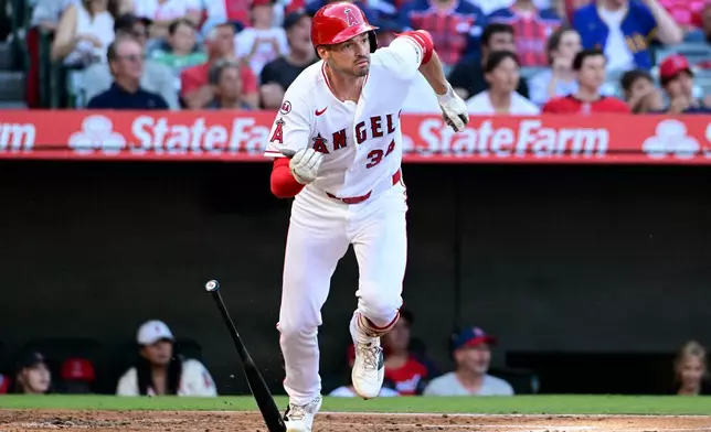 Los Angeles Angels' Trey Mancini starts to run after hitting a a two-run triple against the Tampa Bay Rays in the first inning of a baseball game Friday, June 12, 2026, in Anaheim, Calif. (AP Photo/Wally Skalij)