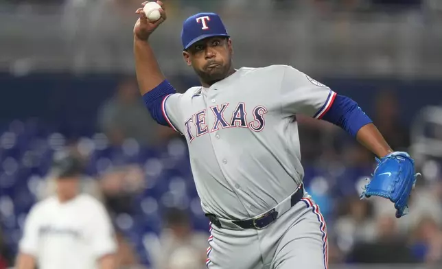 Texas Rangers relief pitcher Kumar Rocker throws out Miami Marlins' Griffin Conine at first during the fifth inning of a baseball game, Monday, June 22, 2026, in Miami. (AP Photo/Lynne Sladky)